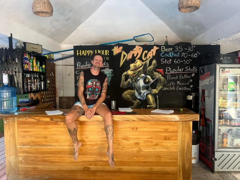 Tom Rance, founder of FortySix, at the bar of the hostel he ran in Puerto Escondido, Mexico
